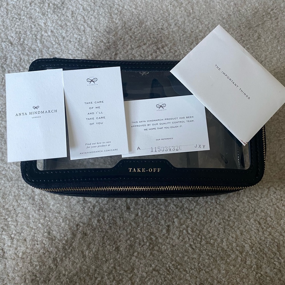 Anya Hindmarch in-flight case black and clear